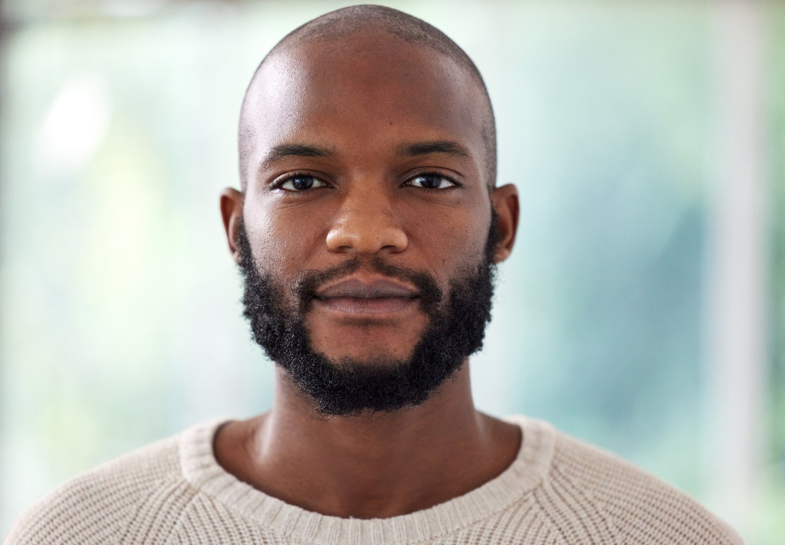 This is my serious face. Headshot of a young man at home.